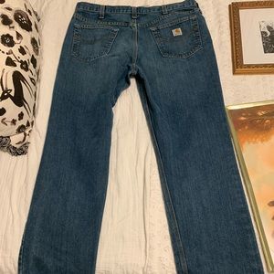 Carhartt blue, denim jeans, size 38x32 with gold stitching.